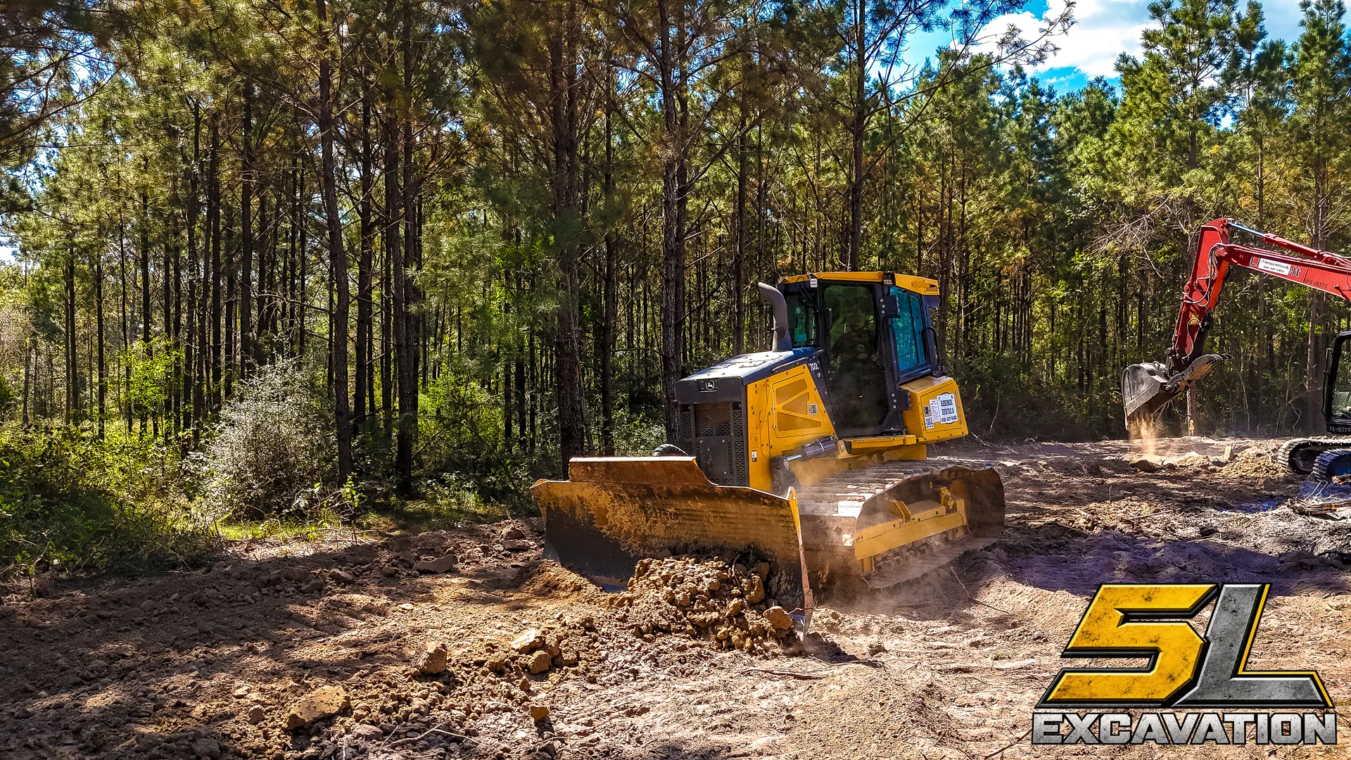 Illustrative yellow excavator on a graded site